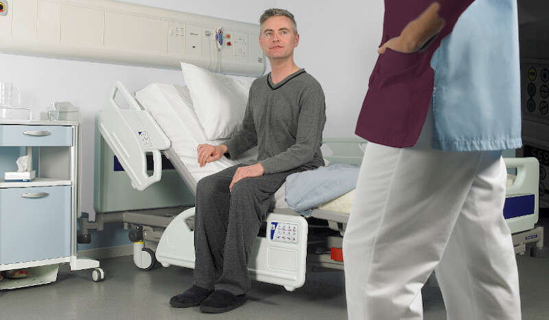 Arjo Enterprise 8000X Sitting edge of bed Main image 2 8000x467_Product_Page_Main_Image